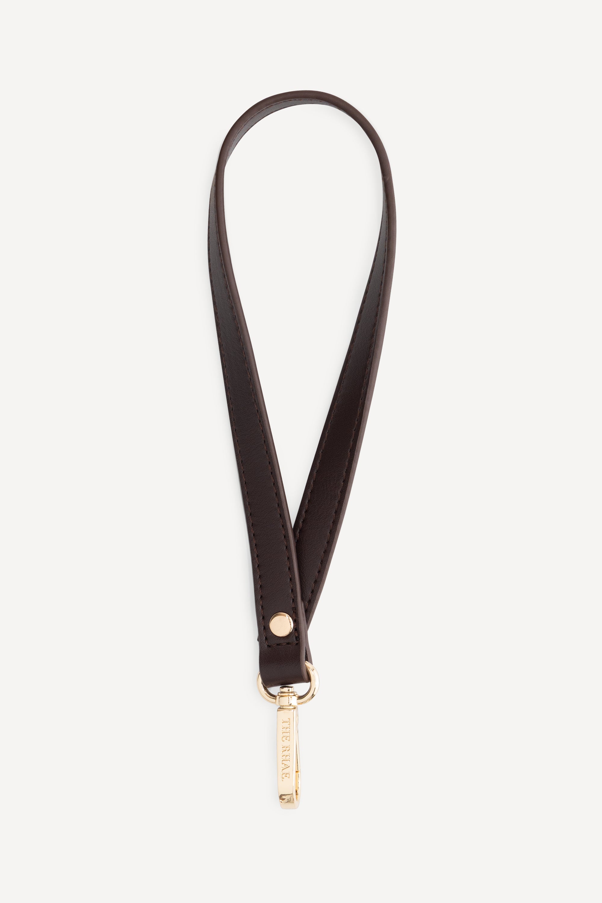 The Rhae Stroller strap Espresso van premium vegan leer met goudkleurige clip